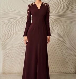 Chic Long Sleeve Burgundy Dress with Embellished Shoulders.